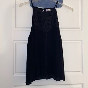 Black halter top with fun lace detail. Flowy fit. Ayla brand size L.